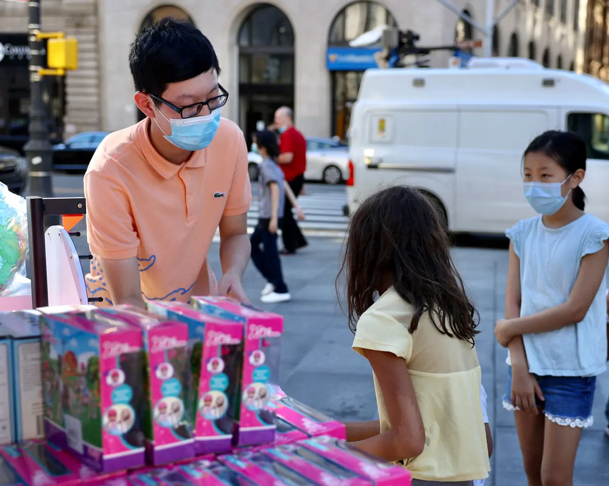 Children receiving donated toys through the Toys for Smiles program